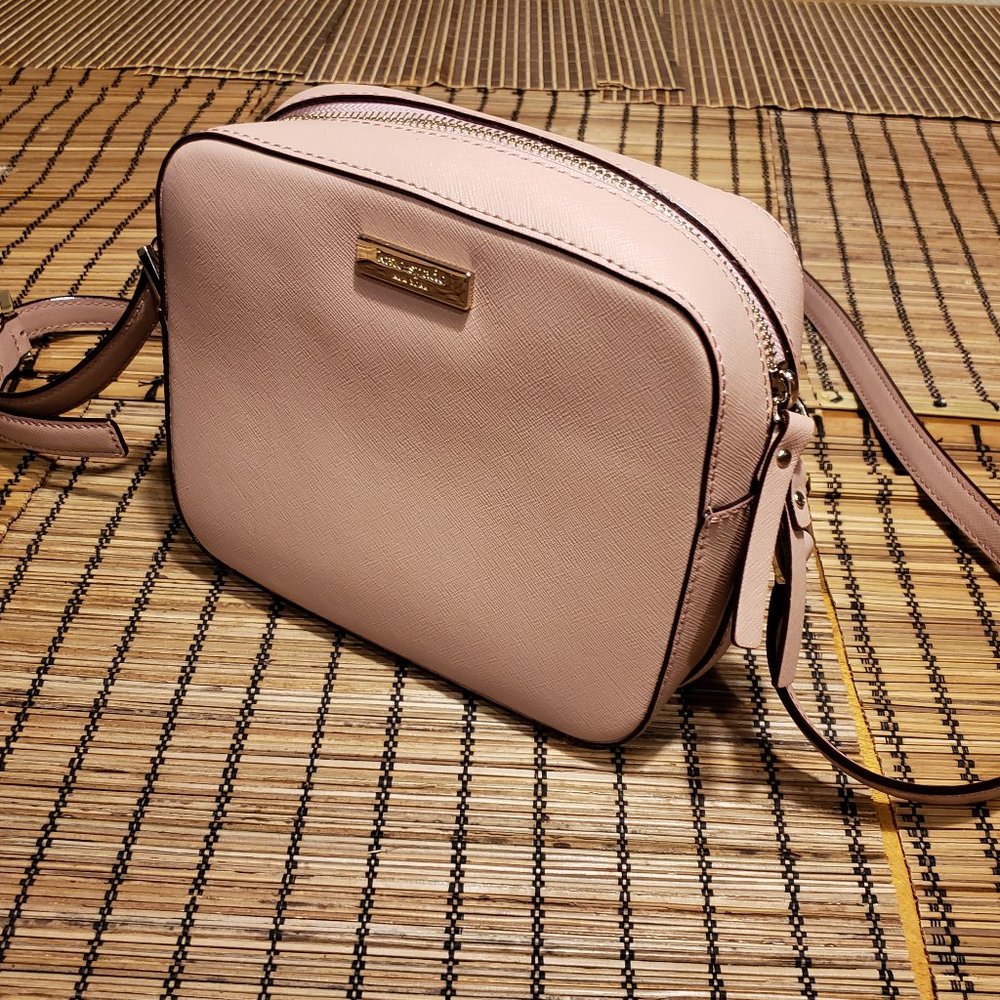 Pink Kate Spade crossbody Camera style bag.